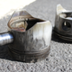 Note the difference: the rings around the other, less damaged piston look like miniature bellows as they spring out around it. The ones around Cylinder No. 2's piston, however, were a solid mass.